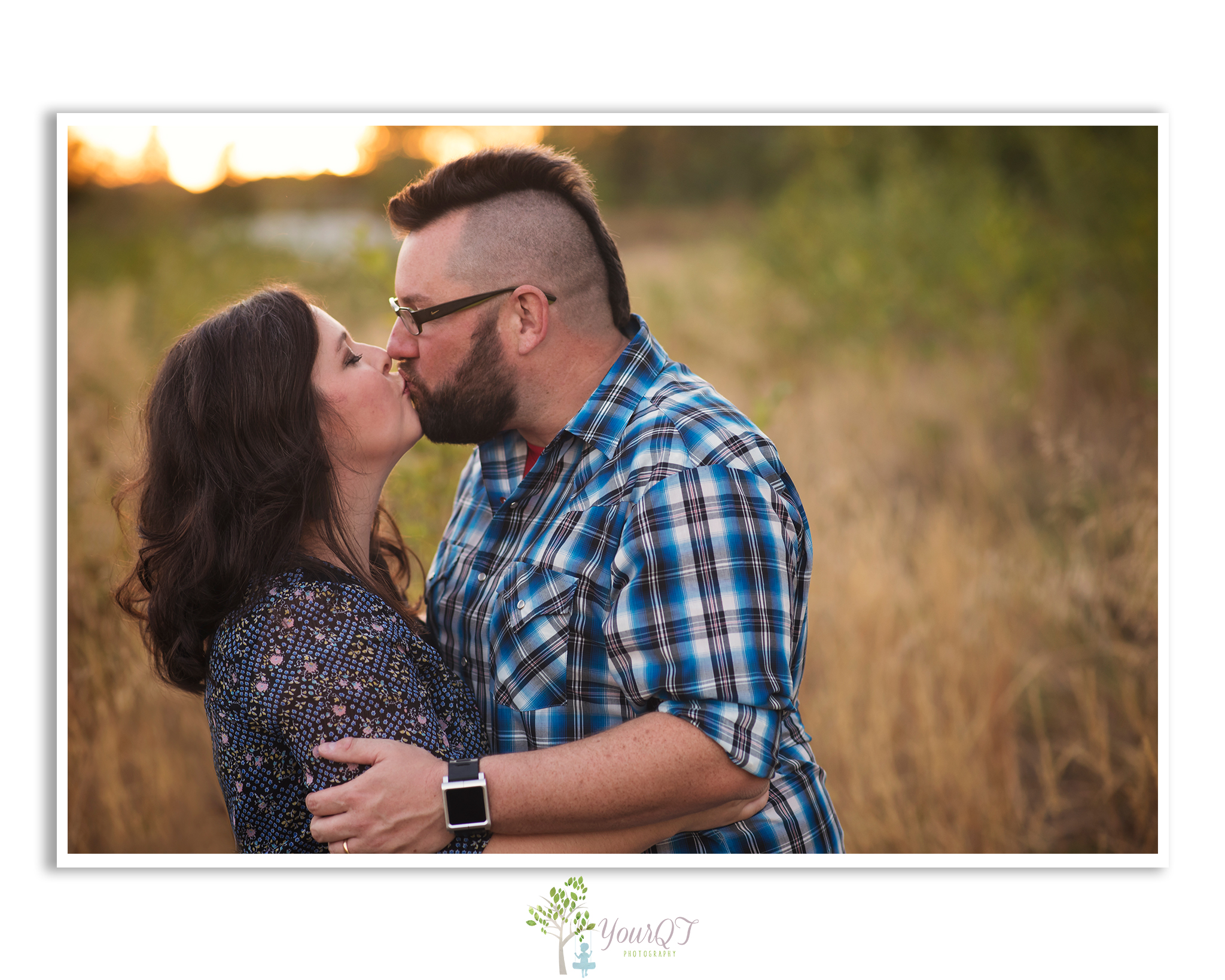 Schultz Family Preview husband and wife kissing in a field