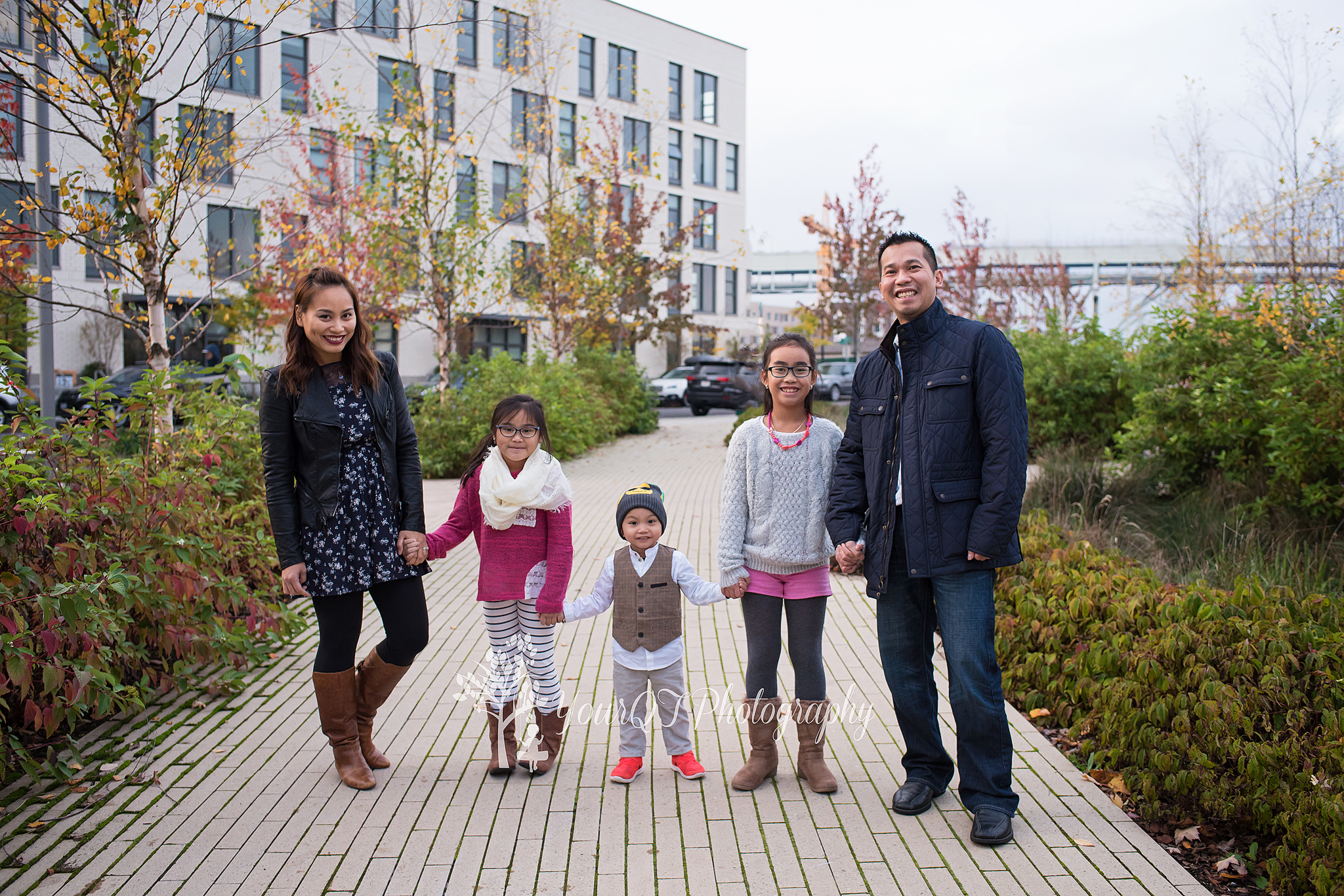 Truong Family City Session Standing and looking at camera together Downtown Portland Oregon